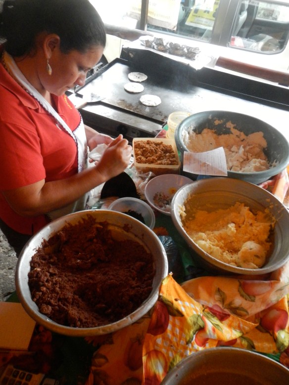 made of thick corn and sometimes rice tortillas and then filled with any combo of cheese, beans, pork, veggies.