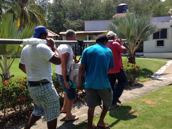 Guys carrying generator