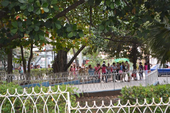 Locals waiting on line for ice cream at Coppelia.