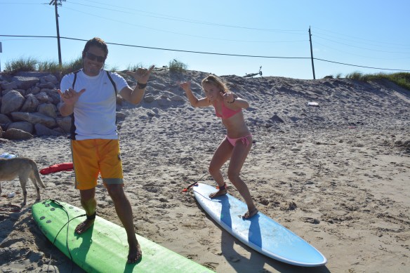 Sophie giving Pete a surfing lesson . Block Island