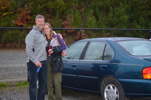 Mike and Holly saying goodbye to "Izzy" who safely brought them across country.   Izzy as in "is he gonna make it"?